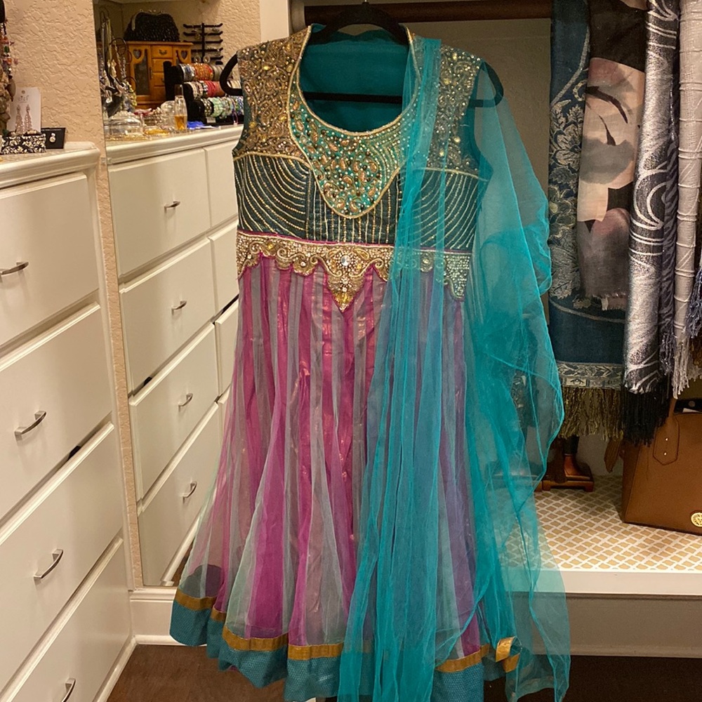 Teal green, purple, and gold Indian Anarkali with dupatta and pants.